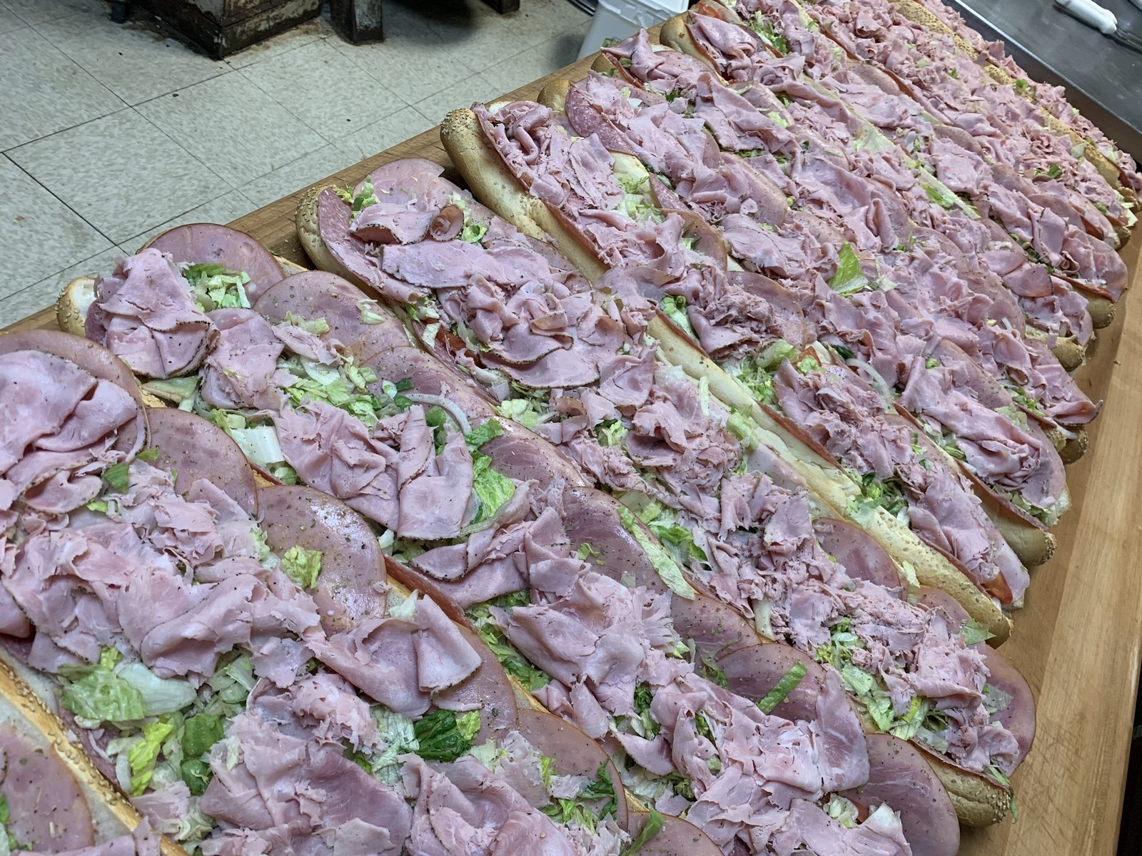 Rows of catering hoagies