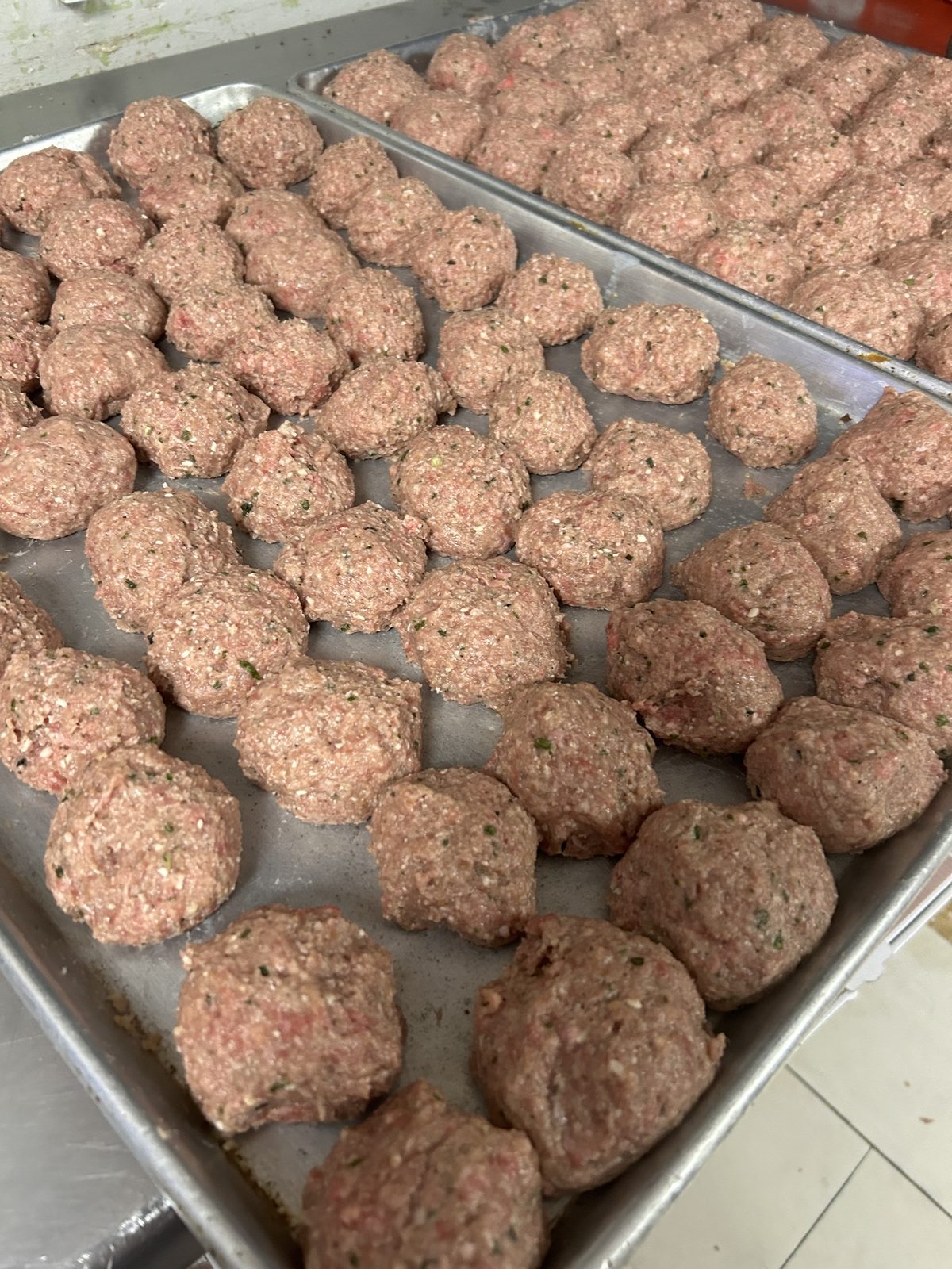 Hand-rolled meatballs in the kitchen